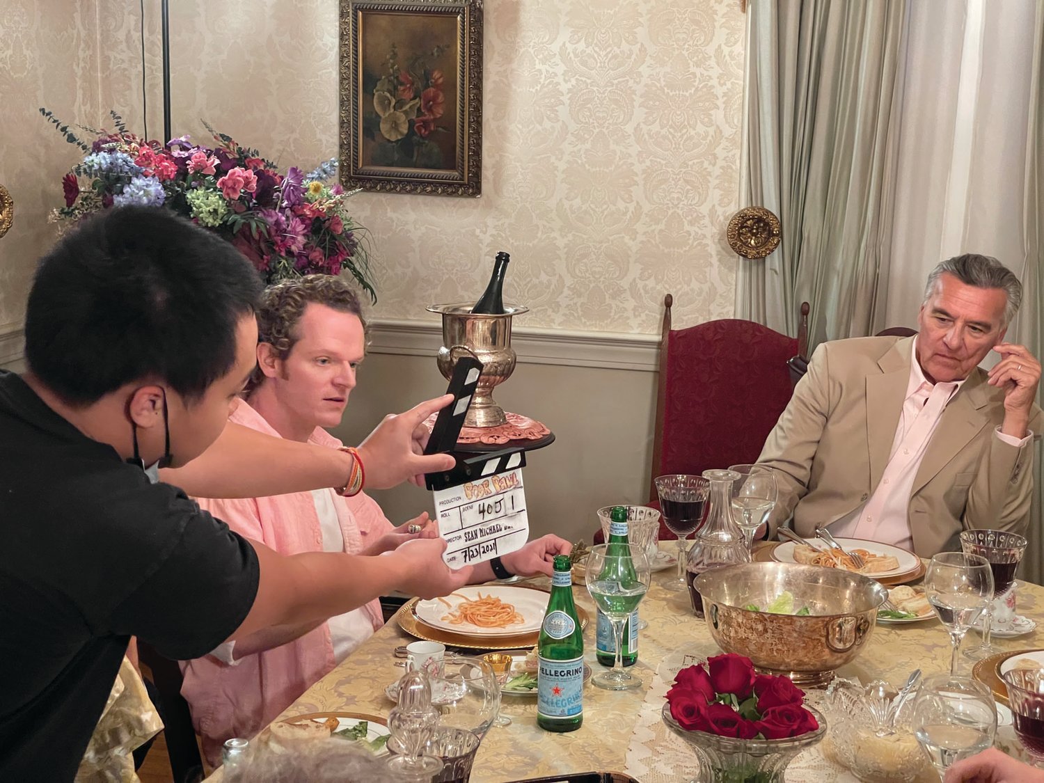 ACTION! Filming begins for a scene in the dining room at Sprague Mansion during Friday’s shoot for “Poor Paul.” Pictured are Nick Pasqual, left, and Stephen O’Neil Martin.